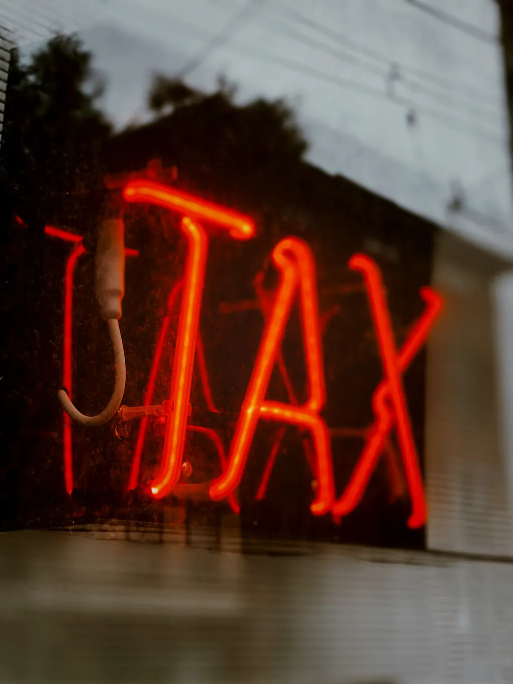 A neon sign glowing red.